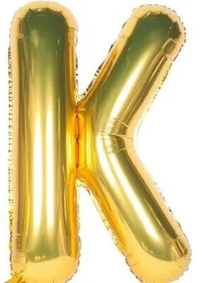 A shiny gold balloon shaped like the letter K.