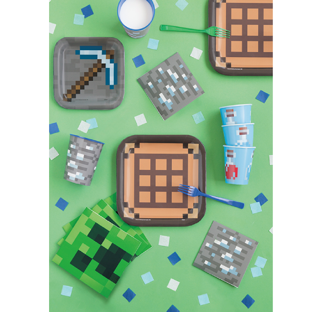 Minecraft-themed party table with cookies, drinks, and a creeper face.