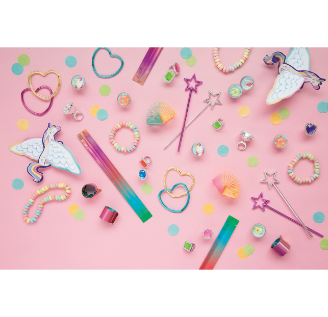 Colorful stationery and accessories on a pink background.